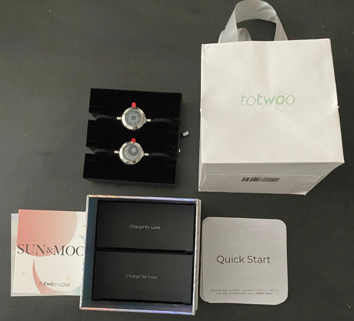 Bracelets, gift bag and manuals
