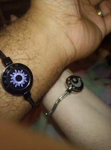 Two wrists wearing the bracelets